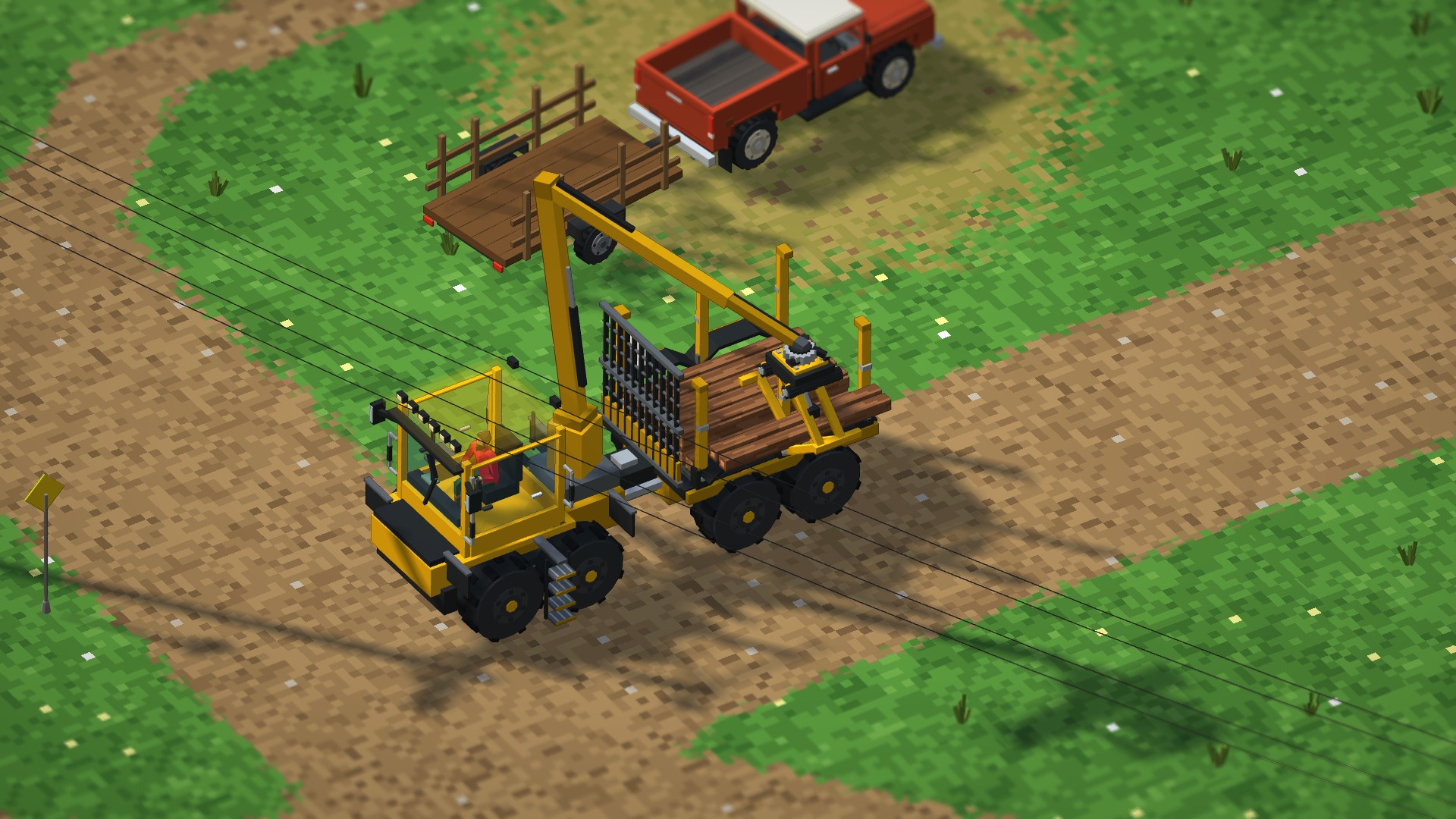 A yellow forwarder lifting logs with its crane.